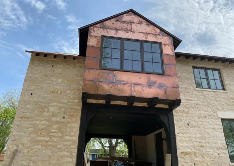 Copper metal panel facade on a stone building for Metal Roof Coating in Du Quoin